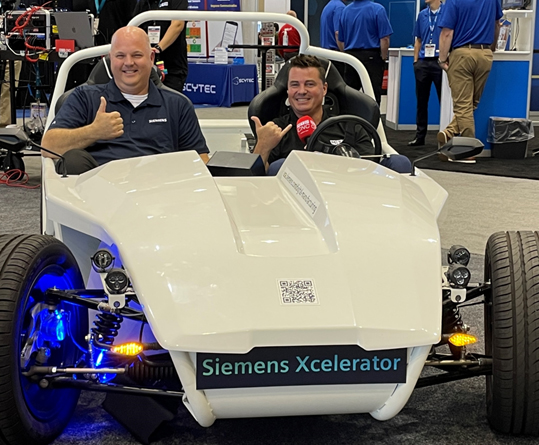 Image of Author Chris Pollack and Tony Gunn from MTDCNC taking a ride in the car that uses the parts detailed here.