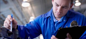 Mechanic checking an engine for repairability with additive manufacturing