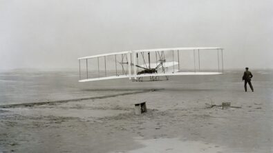 The Wright brothers' Flyer taking off at Kitty Hawk, North Carolina.