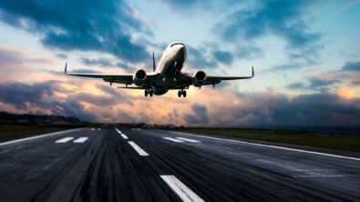 Passenger plane taking off from a runway.