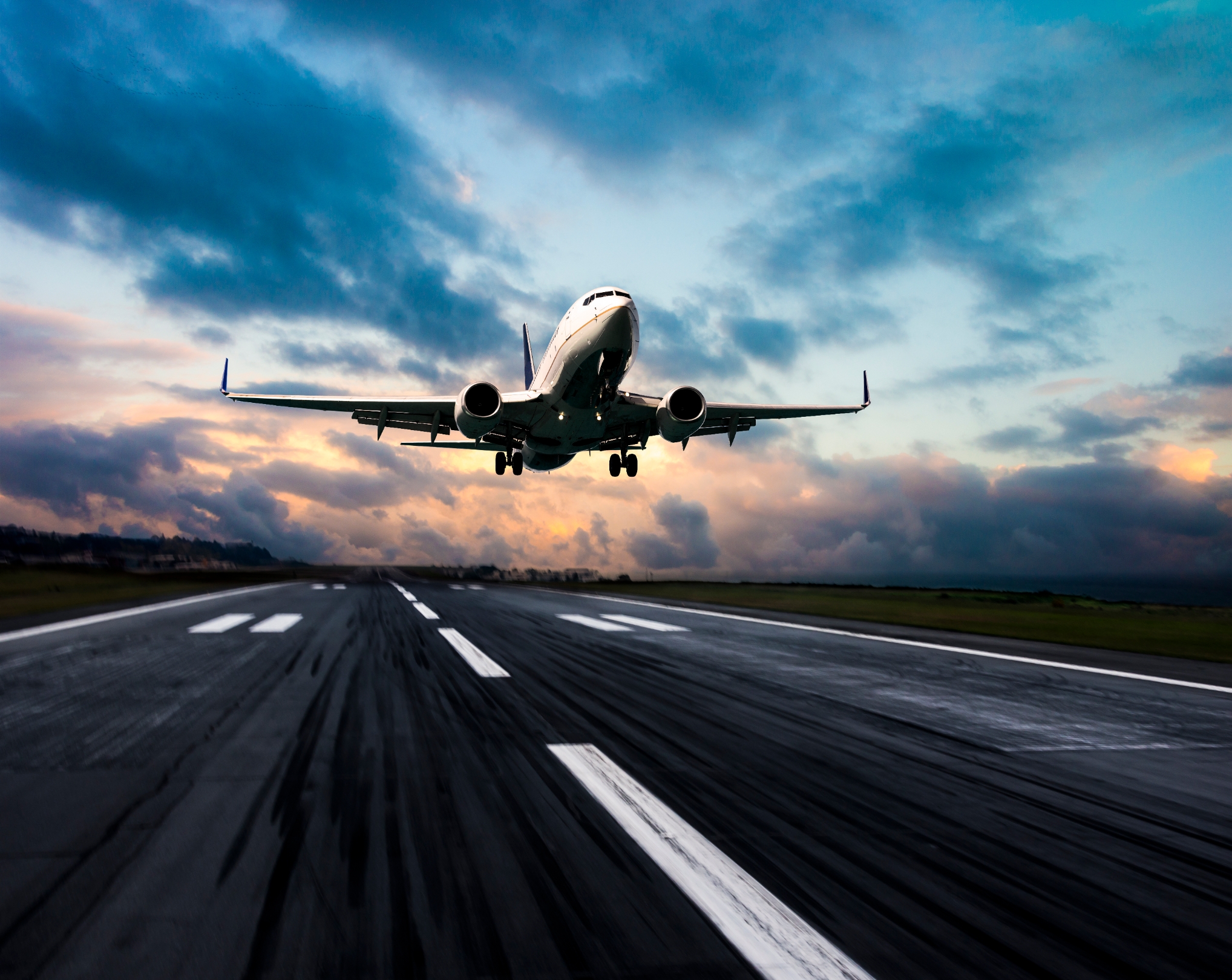 Passenger plane taking off from a runway.