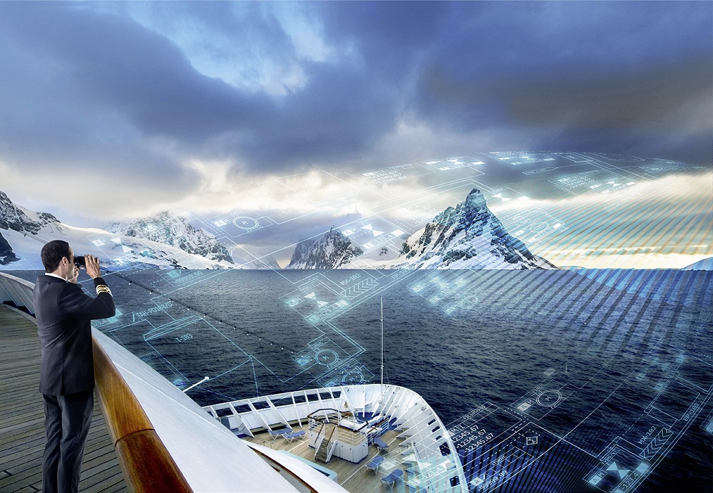 A man with a tablet looking at the horizon from the deck of a ship.