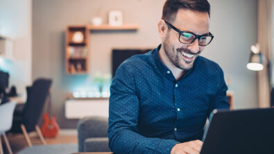 Young man working at home on a laptop