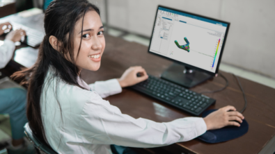 A girl using NX Performance Predictor on NX CAD.