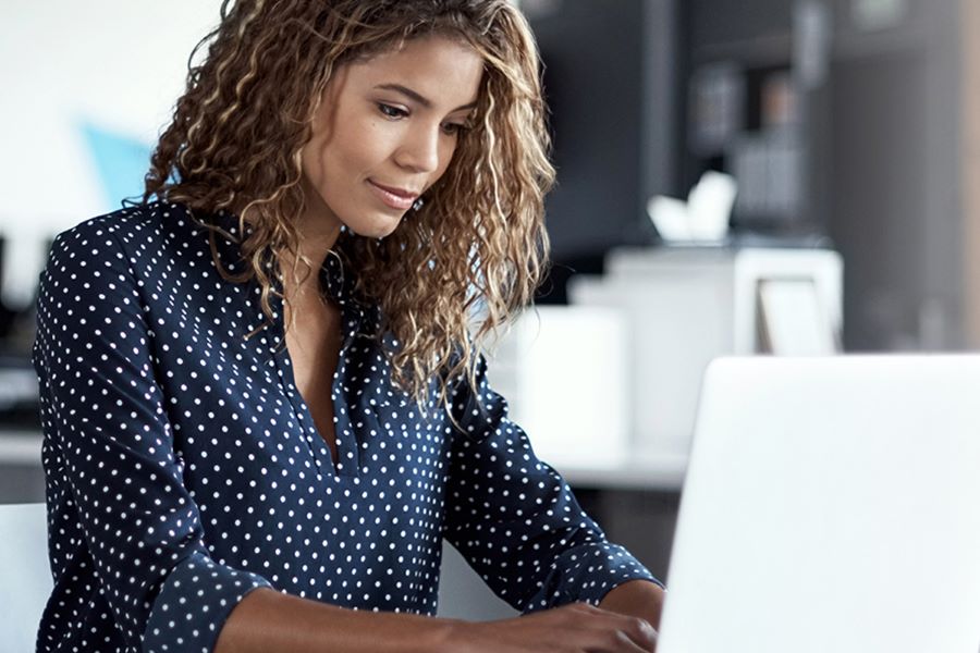 woman typing on a laptop