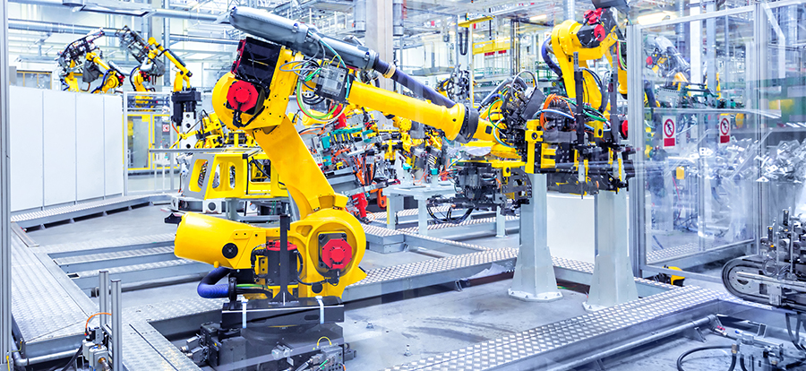 robotic arms in a car plant