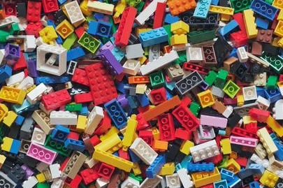 Photo of multi-colored toy building blocks, representing the building-block approach offered in a flexible low-code approach to Sustainability and ESG.