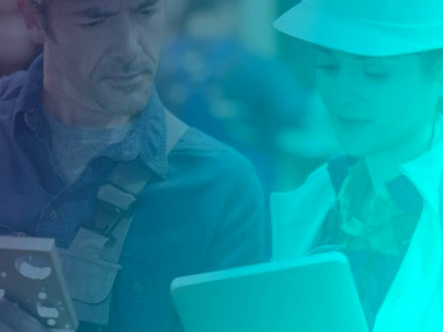 An image of a man and woman on a construction site looking over information on an electronic device. Emixa is a digital transformation consortium formed from several expert firms.