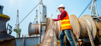 A marine worker working at a shipyard