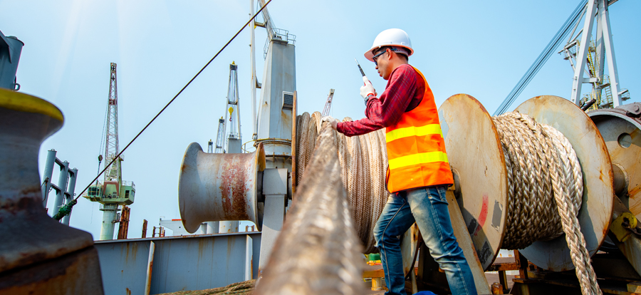 A marine worker working at a shipyard