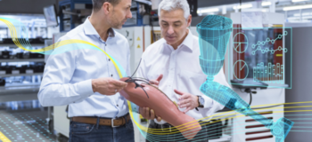 Two white males analyzing a prosthetic leg