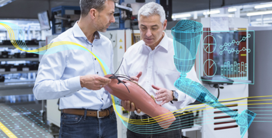 Two white males analyzing a prosthetic leg