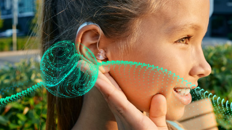 Young female with hearing aid