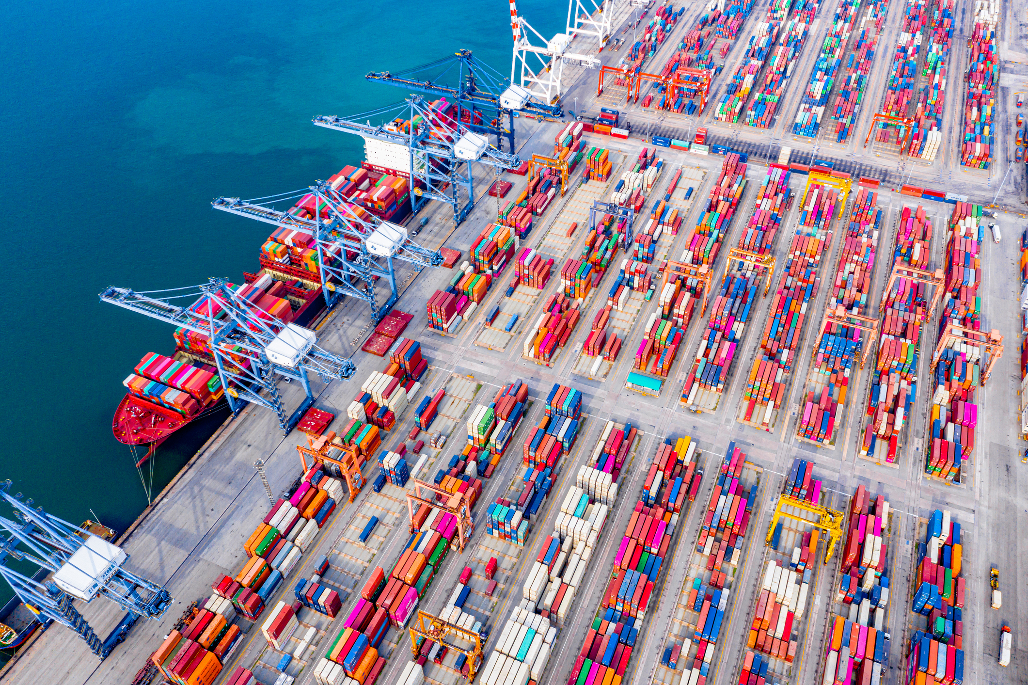 Top view of Deep water port with cargo ship and containers. It is an import and export cargo port where is a part of shipping dock and export products worldwide