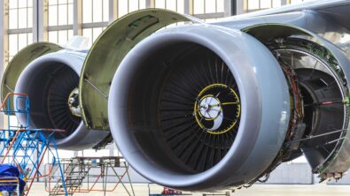 Aircraft engines being maintained in a hangar.