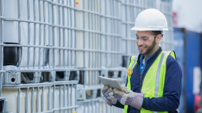 Field engineer using an iPad to inspect equipment.