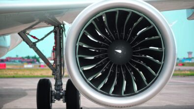 A close-up of an airplane jet turbine from the front.