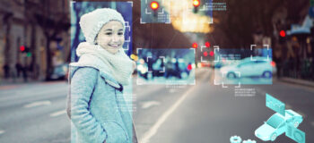 Autonomous vehicles detecting a pedestrian walking across a busy city street.