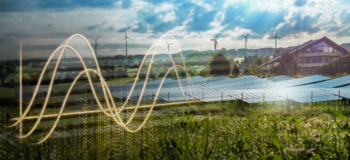 Wind farm and house surrounded by green grass, flowers and digital overlay