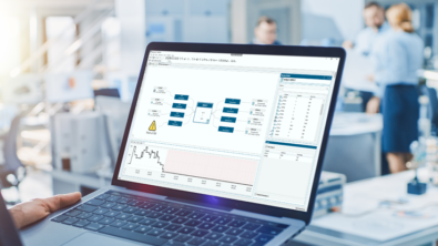 The image shows advanced planning and scheduling software open on a laptop