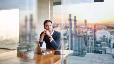 Integrated design for SMBs a man sitting at desk working on Solid Edge