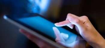 Close-up of a hand using a tablet