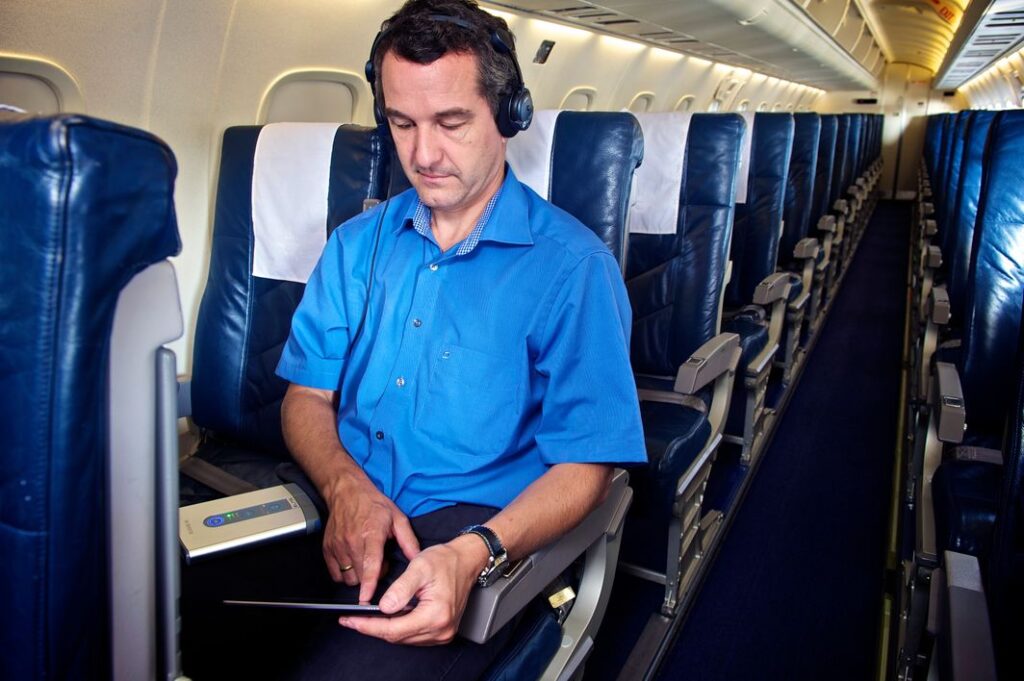 An engineer measure noise inside an aircraft cabin for improved cabin comfort