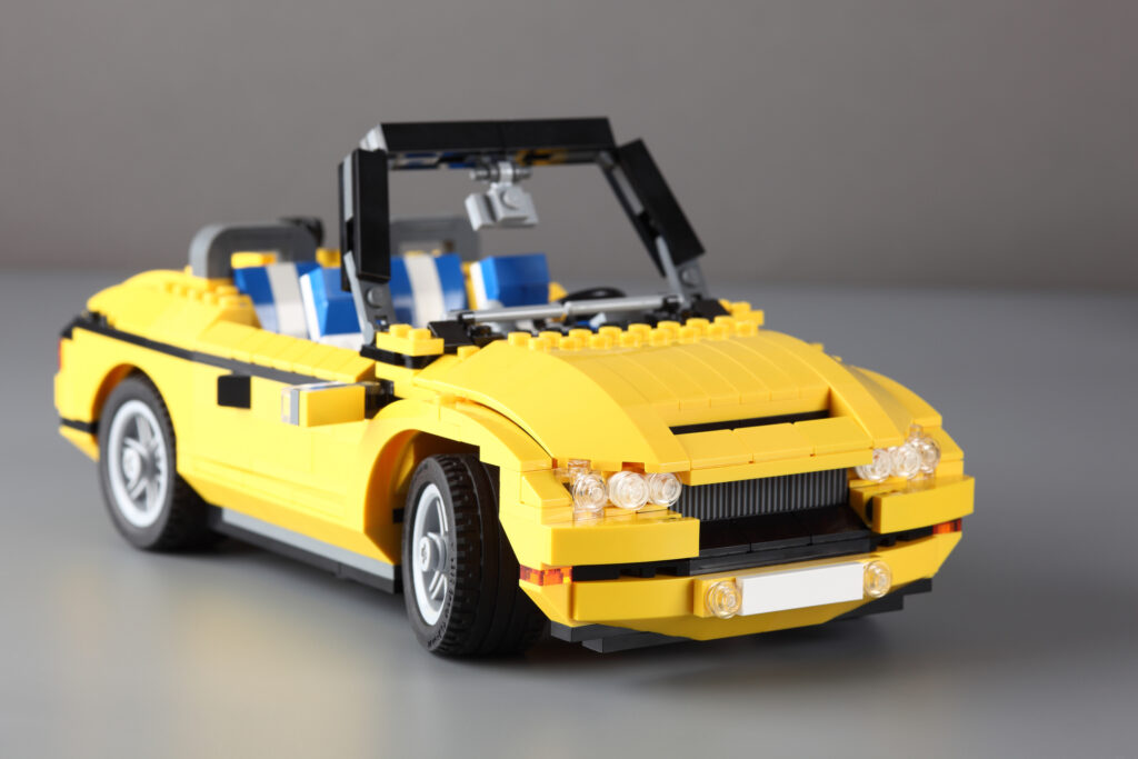 A yellow car made of Lego blocks
