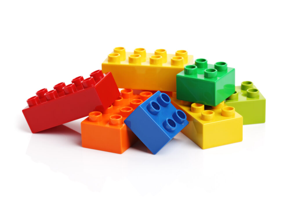 A stack of loose, colored Lego blocks