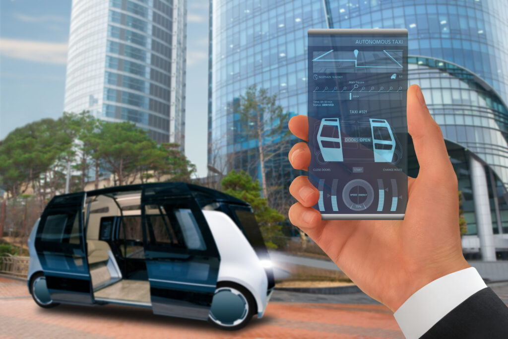 Person hailing an autonomous taxi with a smartphone