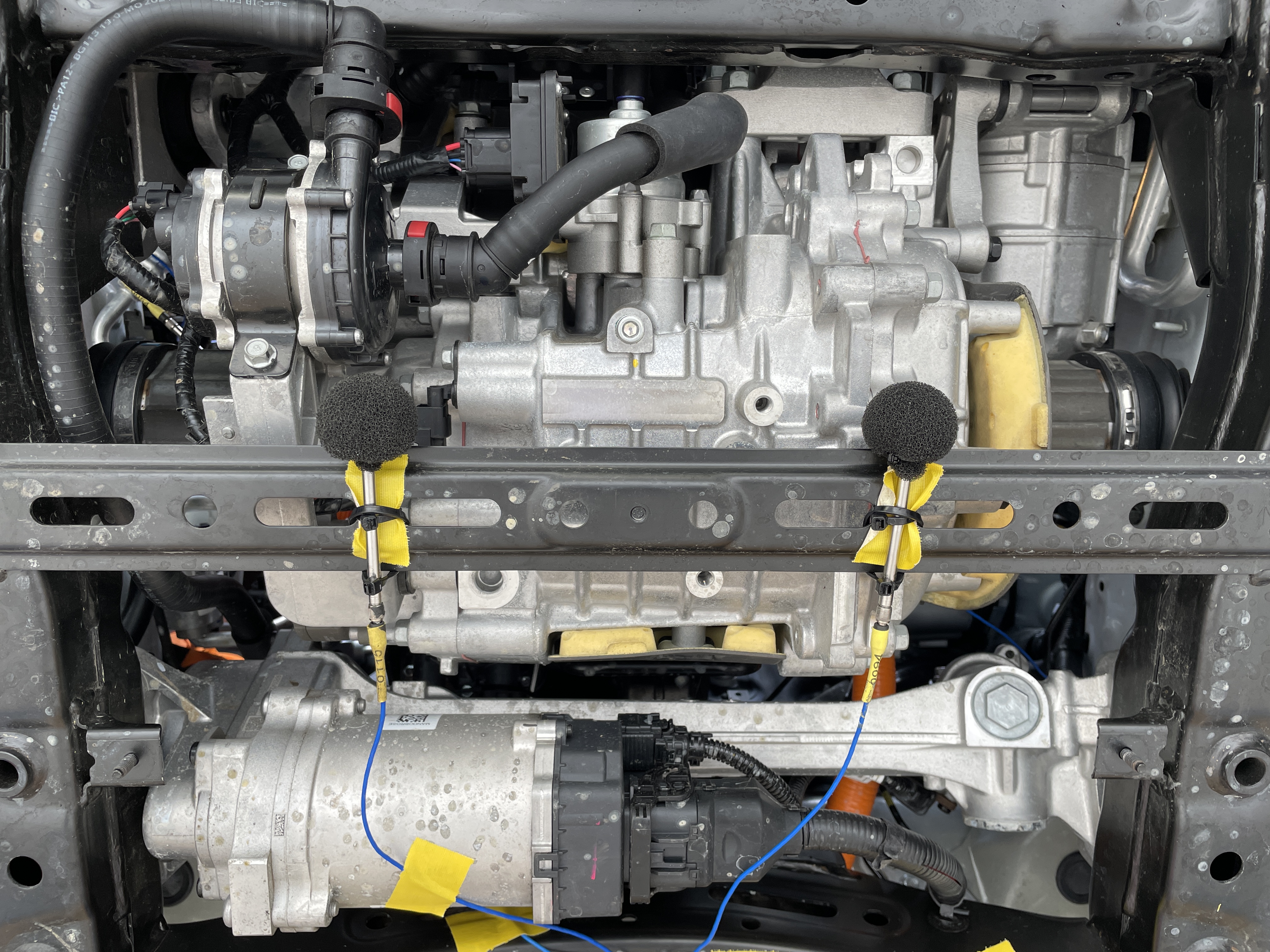 Electric vehicle performance: two microphones measuring noise levels