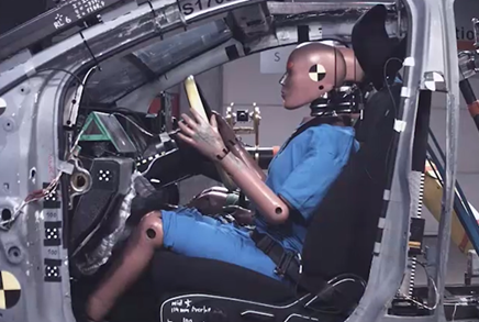 A photograph of an ATD sat in the driver's seat prior to an impact test. 