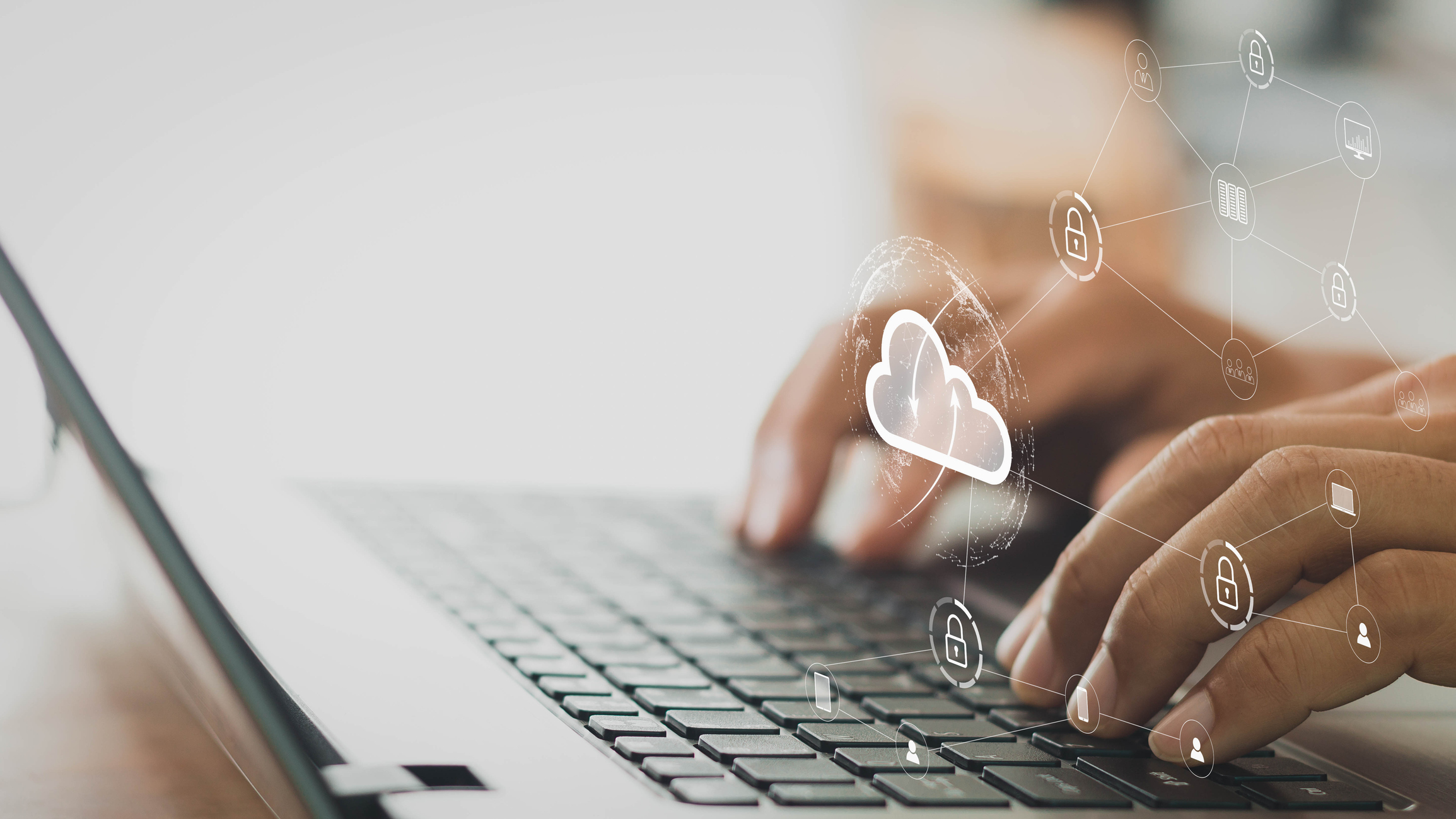 businessman working on his laptop in the home office selects icon cloud on the virtual display. cloud computing technology, internet security, data protection, blockchain, and cyber security concept.